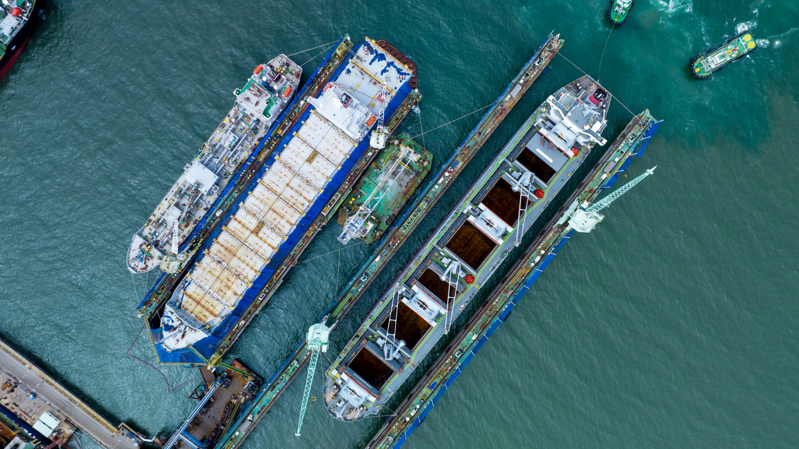 cargo container ship at dry dock concept maintenance service working in the sea. Insurance and Maintenance Cargo Ship concept. Freight Forwarding Service maintenance Insurance
