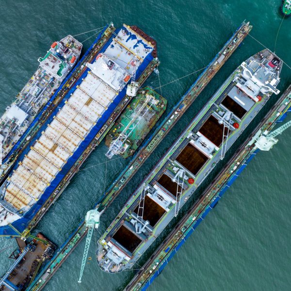 cargo container ship at dry dock concept maintenance service working in the sea. Insurance and Maintenance Cargo Ship concept. Freight Forwarding Service maintenance Insurance