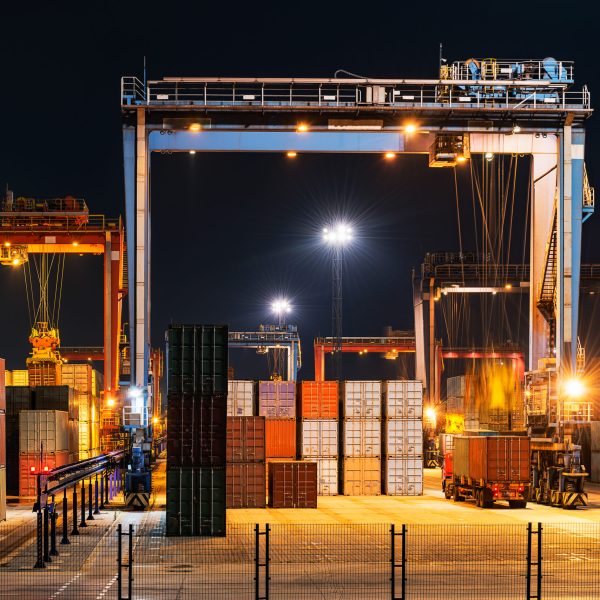 Industrial crane loading Containers in a Cargo freight ship
